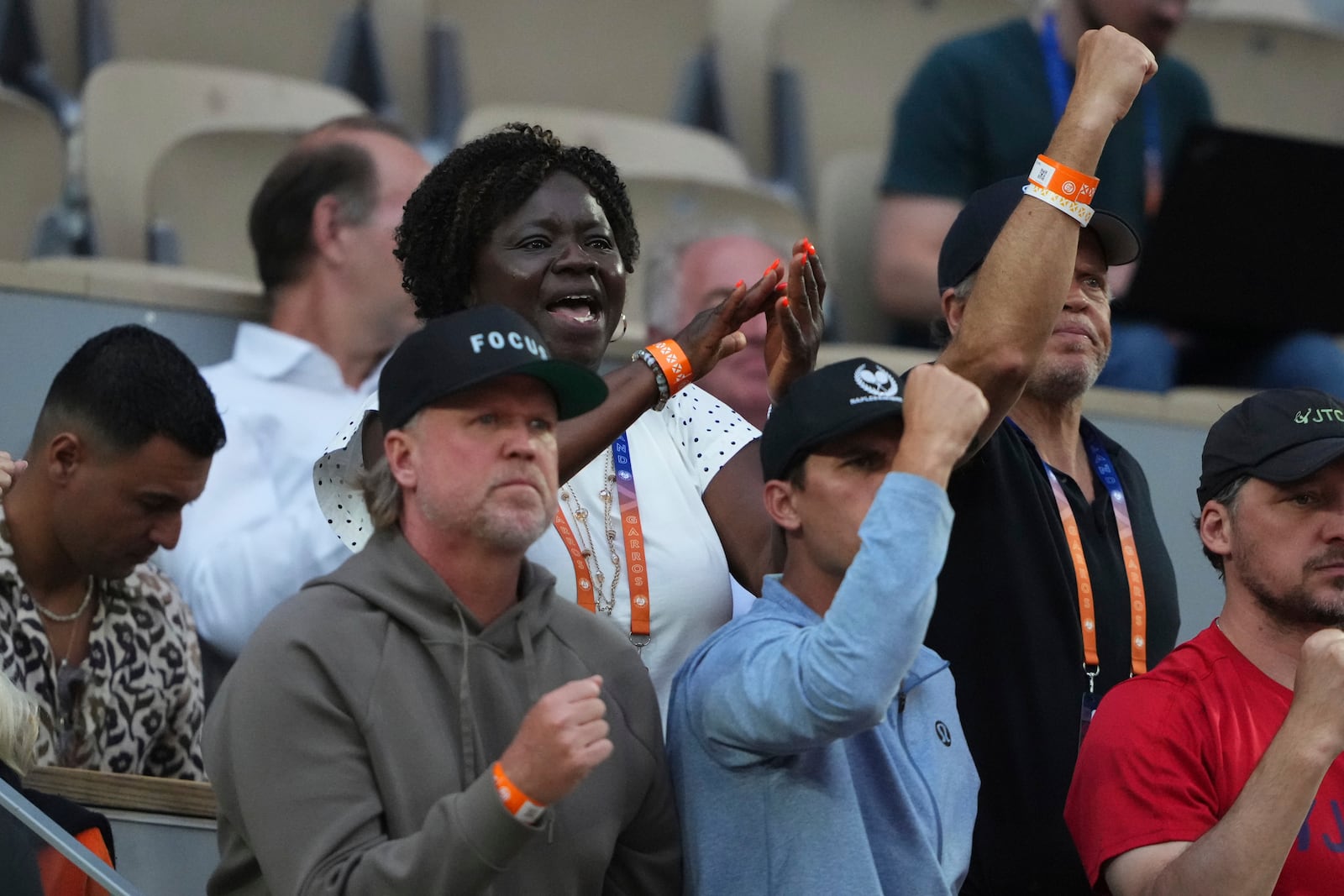Alphina Tamara, top left, mother of Frances Tiafoe, celebrates his son's win over Germany's Daniel Altmaier during their fourth round match of the French Tennis Open, at the Roland-Garros stadium, in Paris, Sunday, June 1 2025. (AP Photo/Lindsey Wasson)