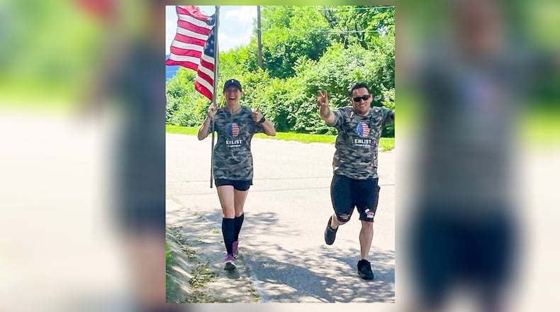 Middletown Mayor Nicole Condrey, accompanied by Master Sergeant Ben Johnis, an Air Force pararescue jumper and member of Team Fastrax, ran 30 miles during 24 hours Monday to raise awareness about the dangers of brain injuries. SUBMITTED PHOTO