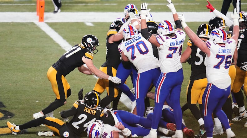 Buffalo Bills quarterback Josh Allen (17) scores a touchdown during the second half of an NFL football game against the Pittsburgh Steelers Sunday, Nov. 30, 2025, in Pittsburgh. (AP Photo/Gene J. Puskar)