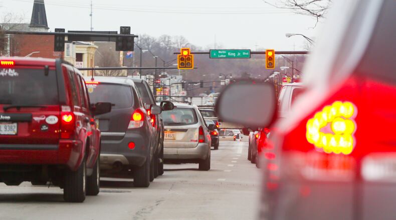Hamilton will go ahead with planned tweaks of traffic signals along the High-Main corridor through downtown, but will have traffic consultants on hand to change the signals immediately if backups ensue on side streets, City Manager Joshua Smith told City Council. GREG LYNCH / STAFF