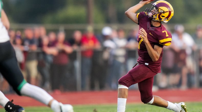 Ross quarterback C.J. Boze passes the ball during the Rams’ season-opening 41-20 loss to Badin last Friday at Robinson Field in Ross Township. NICK GRAHAM/STAFF