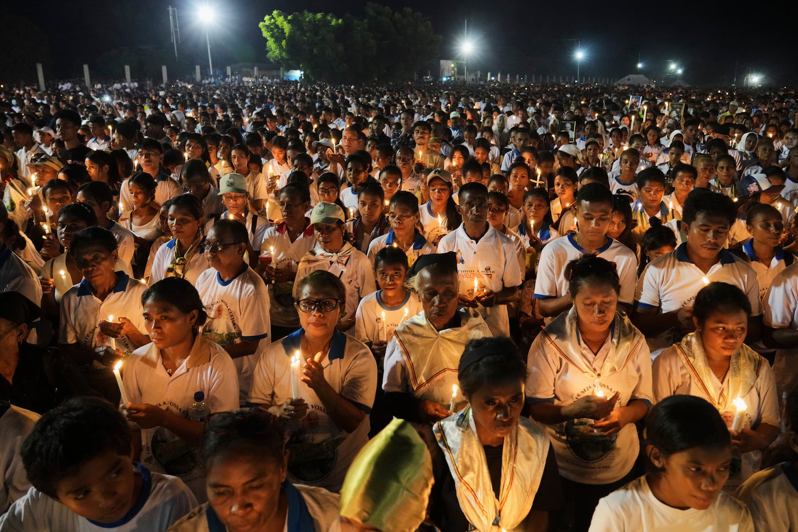 Devotees light candles during a Requiem Mass for the late Pope Francis, in Dili, East Timor, Saturday, April 26, 2025. (AP Photo/Firdia Lisnawati)