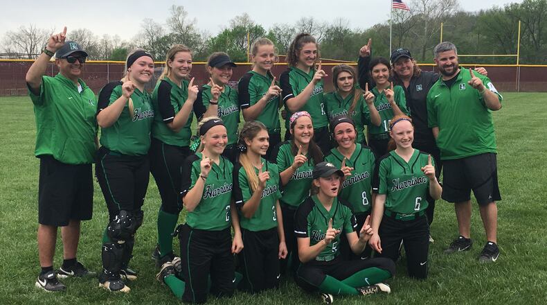The Harrison Wildcats pose for photos Saturday afternoon following their 7-3 win at Ross, which clinched the outright Southwest Ohio Conference championship. RICK CASSANO/STAFF