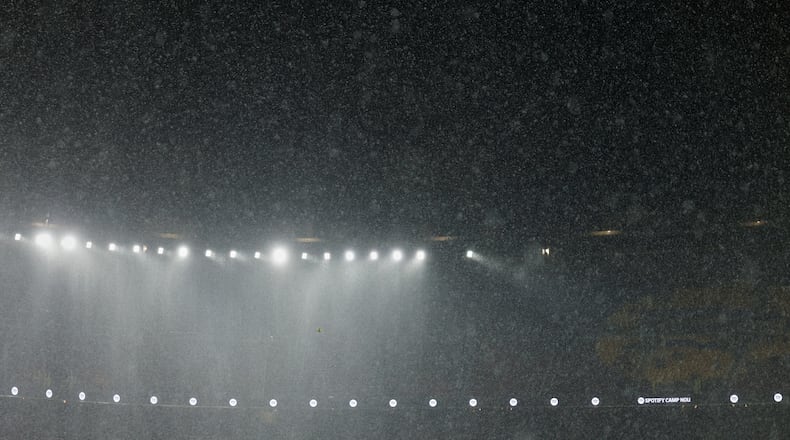 A heavy rain falls on the field during a Spanish La Liga soccer match between Barcelona and Real Oviedo in Barcelona, Spain, Sunday, Jan. 25, 2026. (AP Photo/Joan Monfort)