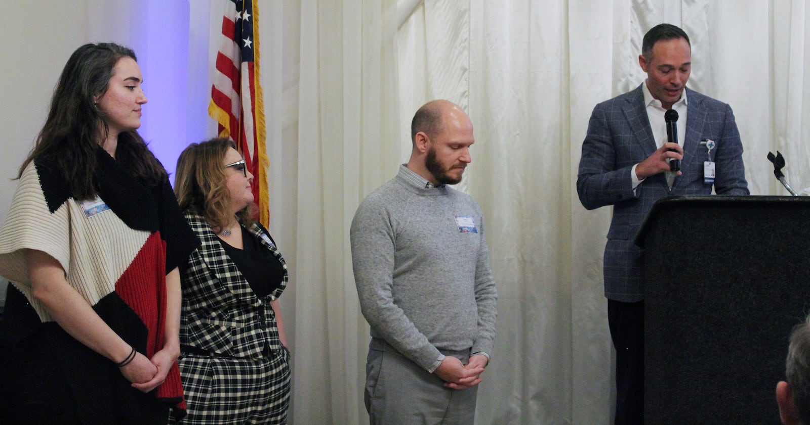 Fairfield Chamber of Commerce's governing board member Justin Krueger presented the organization's Community Champion Award to the Shared Harvest Foodbank, represented by, from left, Amberlee Finkes, Allie Godfrey and Terry Perdue. SUE KIESEWETTER/CONTRIBUTED