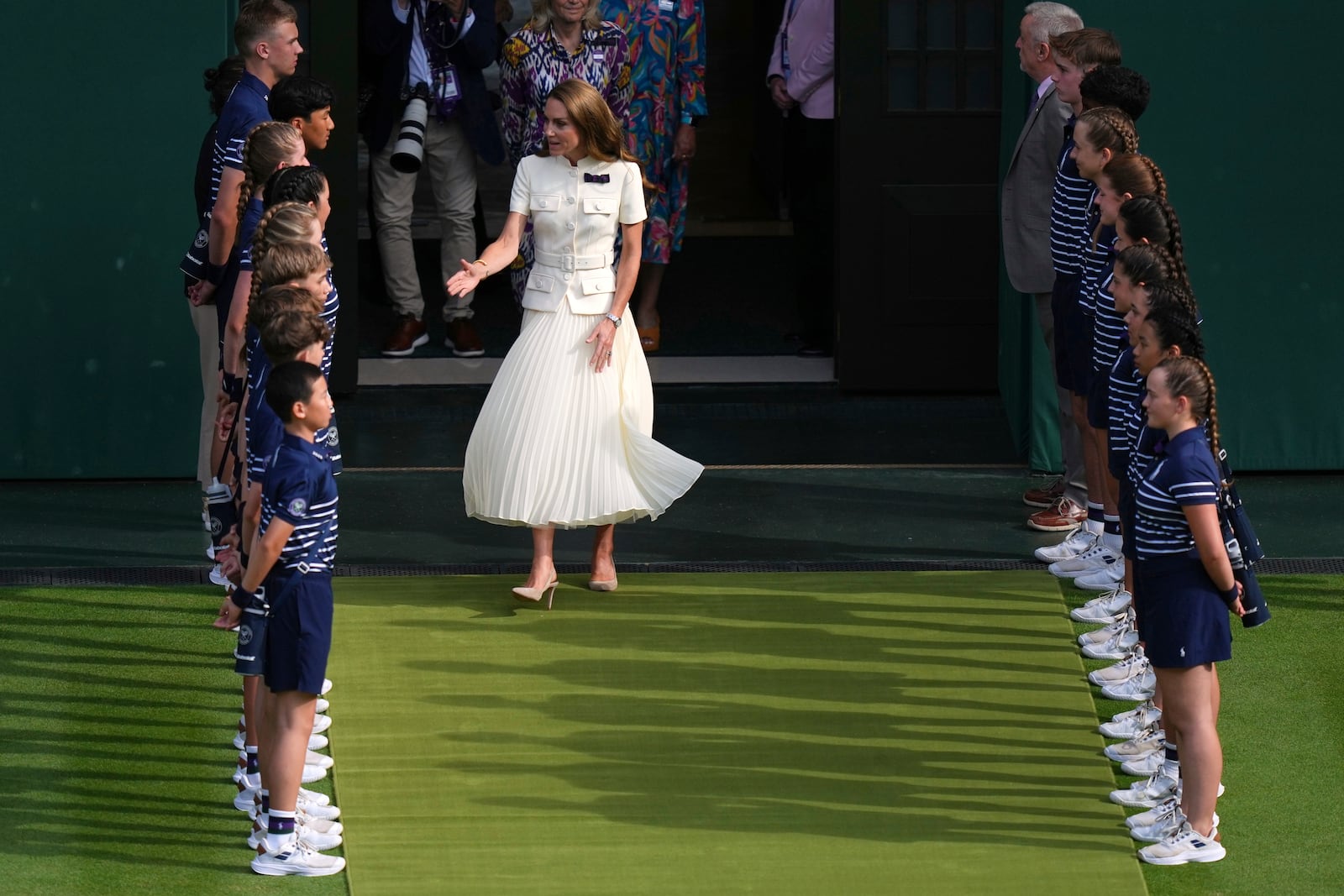 Britain's Kate, the Princess of Wales, arrives to hand over the trophy to Iga Swiatek of Poland after winning the women's singles final match against Amanda Anisimova of the U.S. at the Wimbledon Tennis Championships in London, Saturday, July 12, 2025.(AP Photo/Joanna Chan)