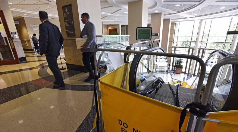 The escalator in the lobby of the Government Services Center that is stopped more than moving is on the $3.6 million capital improvement list for 2020 that the Butler County commissioners will consider. The escalator in the lobby of the Government Services Center has not been fully operational since May because a part has to be made to fix it. The up escalator is functional, but if you want to go down you have to either take the elevator or the stairs. The escalator is original to the building which opened in 1999 and it is getting more costly to maintain. NICK GRAHAM/STAFF