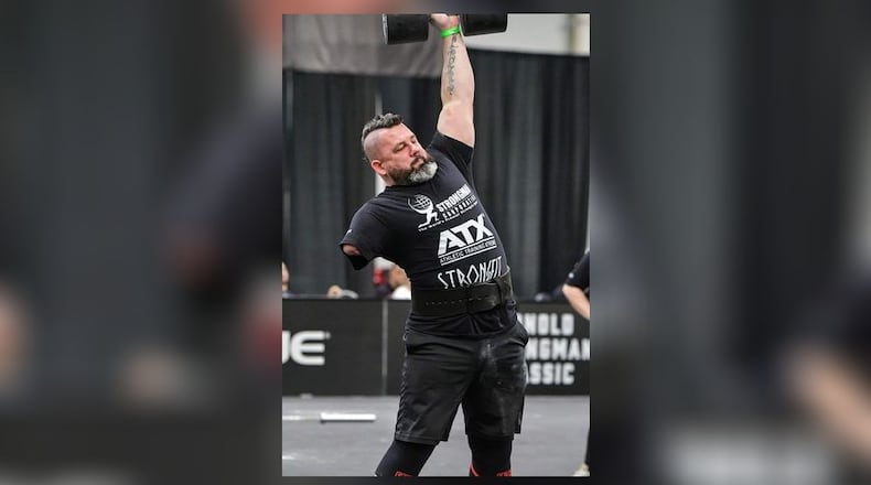 Middletown High School special education classroom assistant - and former firefighter - Mike Diehl inspires students through competing in international disabled athlete and strongman competitions. (Provided Photo\Journal-News)