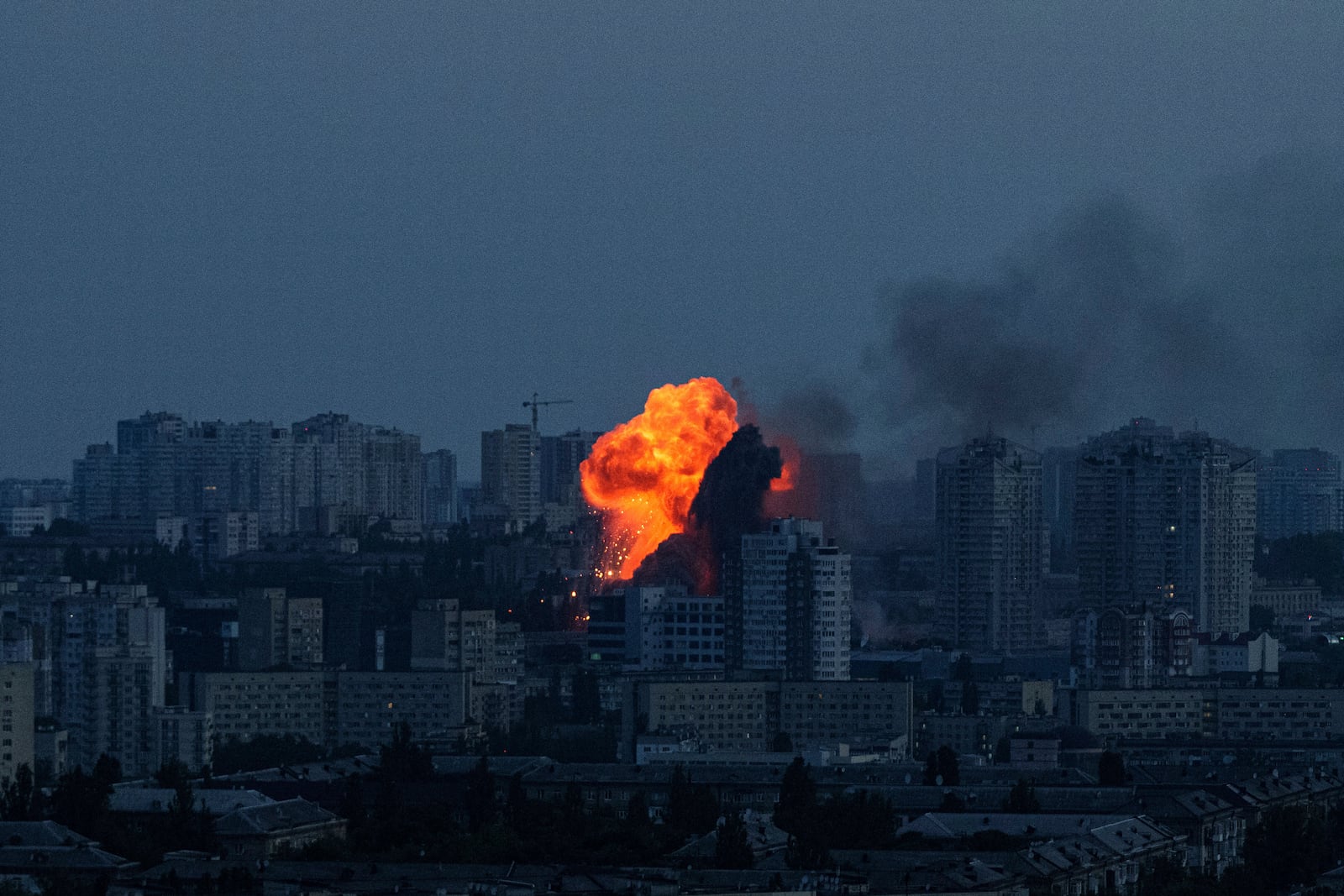 Explosion is seen after Russian air strike on Kyiv, Ukraine, on Friday, June 6, 2025. (AP Photo/Evgeniy Maloletka)