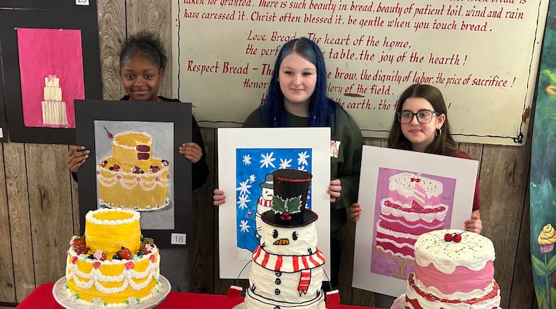 Three seventh-graders from Middletown Middle School were recognized for finishing in the Top 3 in a painting contest at Central Pastry Shop. From left: London Green (third), Gracie Drew (second) and Nora Orick (first) with their paintings and cakes. RICK McCRABB/CONTRIBUTOR