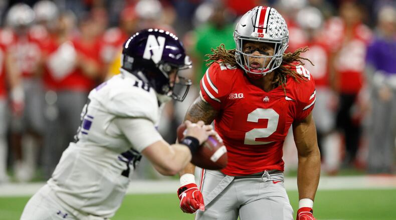 INDIANAPOLIS, INDIANA - DECEMBER 01: Chase Young #2 of the Ohio State Buckeyes chases down Clayton Thorson #18 of the Northwestern Wildcats in in the third quarter at Lucas Oil Stadium on December 01, 2018 in Indianapolis, Indiana. (Photo by Joe Robbins/Getty Images)