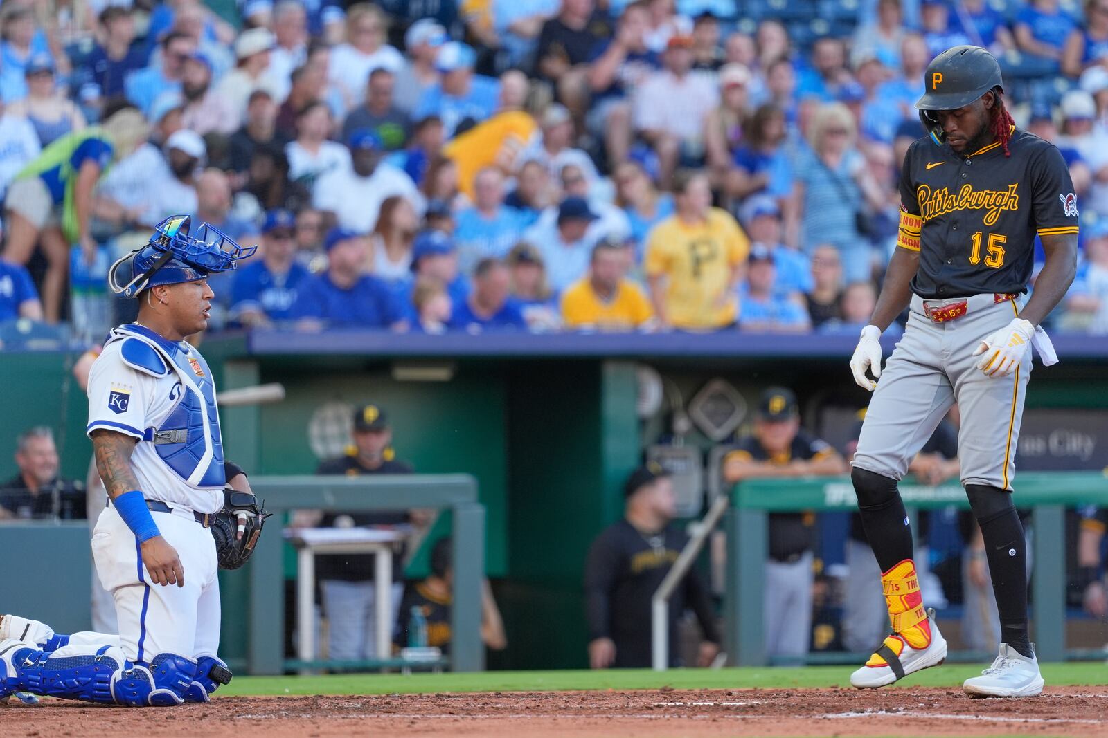 Pittsburgh Pirates' Oneil Cruz (15) crosses the plate past Kansas City Royals catcher Salvador Perez after hitting a solo home run during the fourth inning of a baseball game Tuesday, July 8, 2025, in Kansas City, Mo. (AP Photo/Charlie Riedel)
