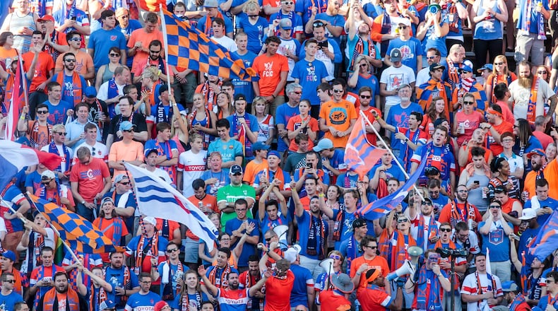 Fans cheer on the FC Cincinnati team as they play English Premier League team Crystal Palace last year at Nippert Stadium in Cincinnati. NICK GRAHAM/STAFF