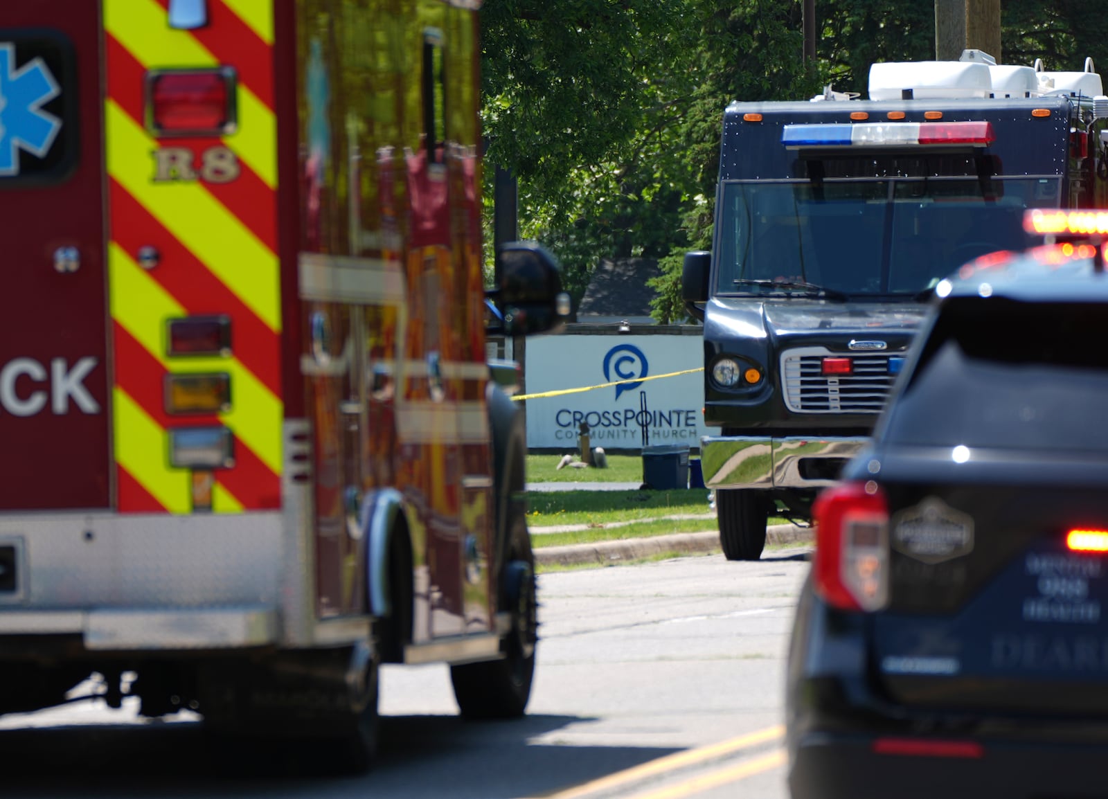 Emergency vehicles gather near CrossPointe Community Church in Wayne, Mich., Sunday, June 23, 2025. (AP Photo/Paul Sancya)