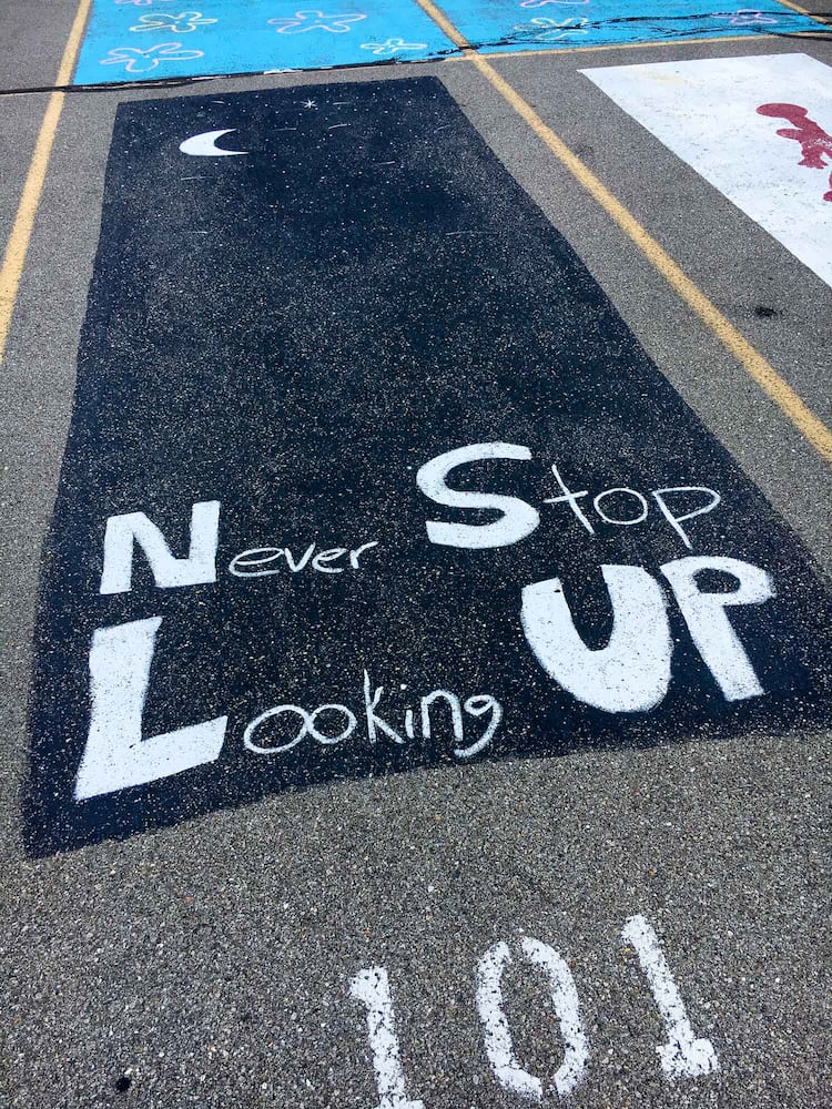 PHOTOS Lakota East seniors paint parking spots