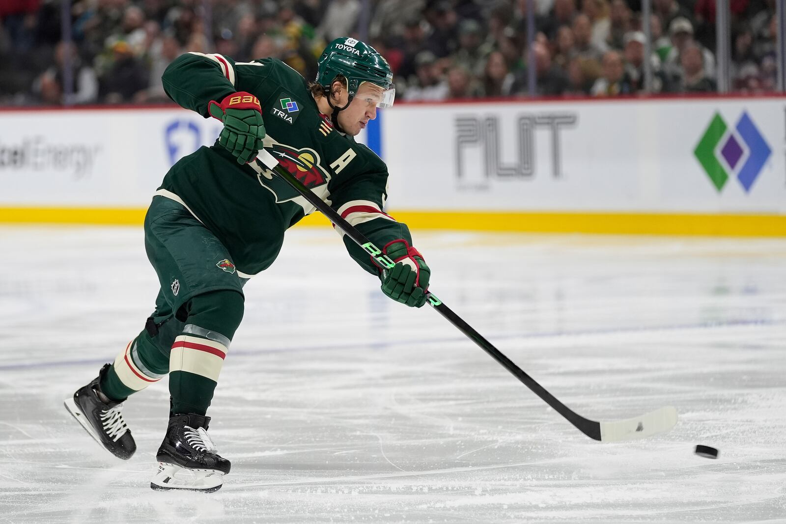 Minnesota Wild left wing Kirill Kaprizov (97) shoots the puck during the third period of an NHL hockey game against the San Jose Sharks, Wednesday, April 9, 2025, in St. Paul, Minn. (AP Photo/Abbie Parr)
