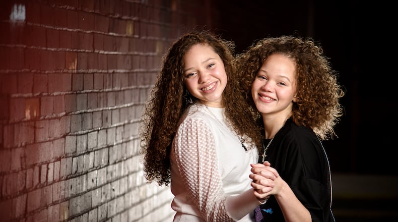 The Cunningham sisters, Macie, 15, left, and Marie, 13, have been singing on social media trying to spread a positive message and recently sent an audition video to the television show The Voice. NICK GRAHAM / STAFF