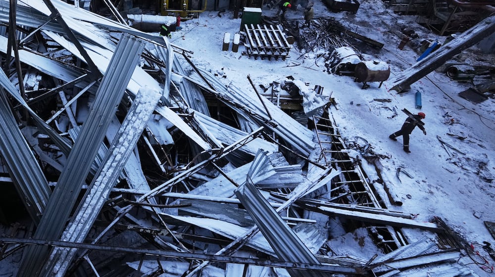Workers repair the destroyed DTEK company's power plant after a Russian missile attack on the country's energy system in an undisclosed location in Ukraine, Monday, Feb. 9, 2026. (AP Photo/Sergei Grits)