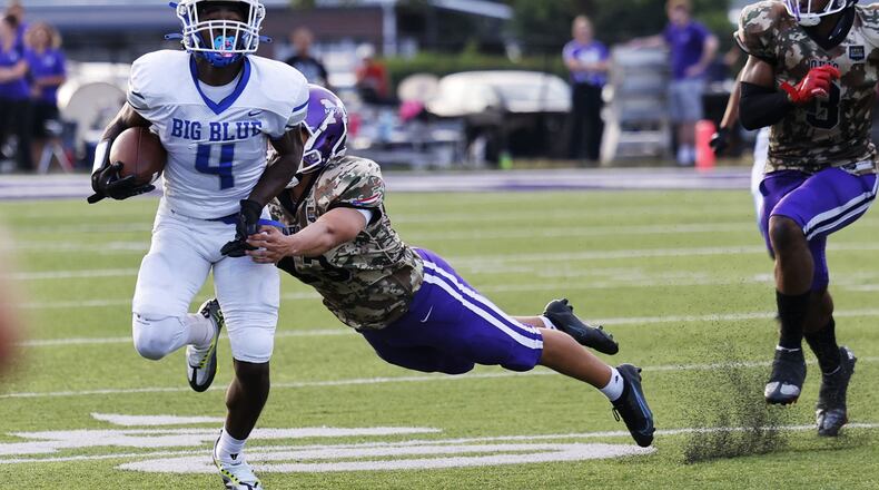 Hamilton’s Jaylan Garrett carries the ball during their football game against Middletown Friday, Sept. 2, 2022 at Barnitz Stadium in Middletown. Hamilton won 17-0. NICK GRAHAM/STAFF
