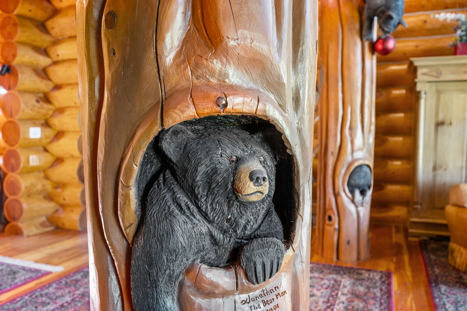 The 7,000-square-foot custom log home features 33 custom bear carvings by Wyoming artist Jonathan LaBenne, who spent six weeks completing the carvings inside and out at Saguaro Ranch outside Waynesville in Warren County. CONTRIBUTED