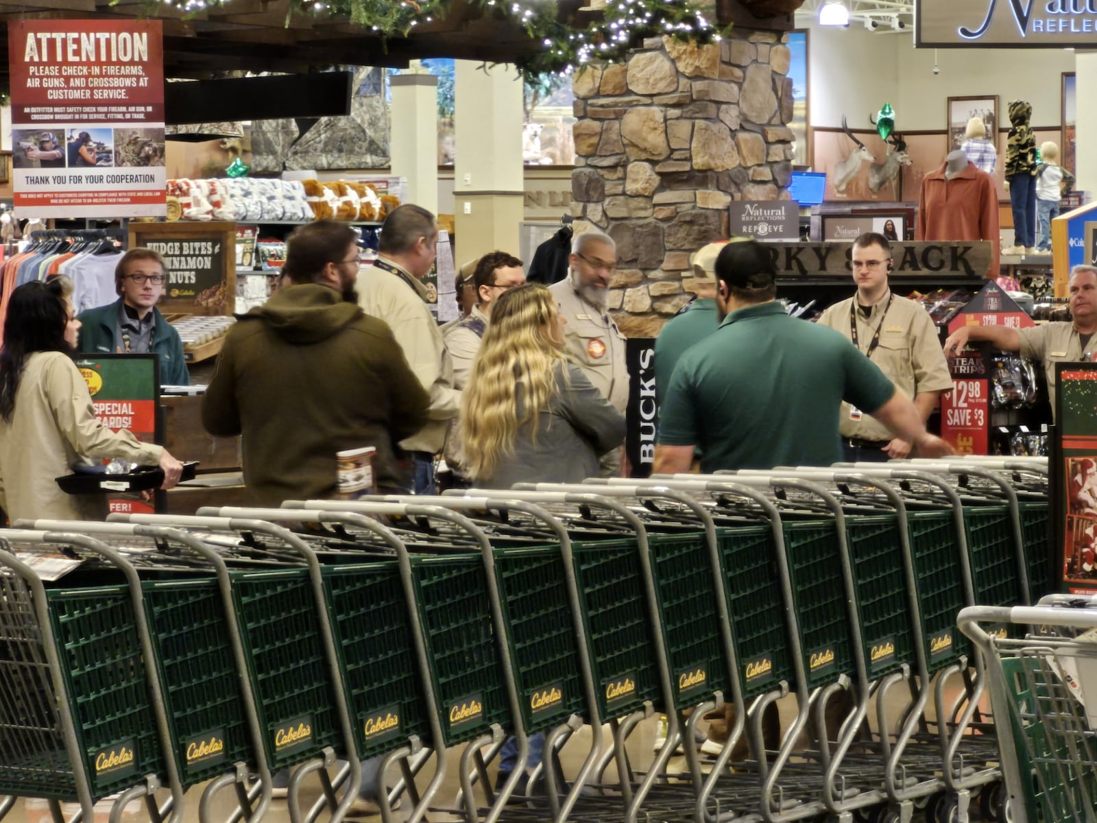Cabela's staff members huddle before opening the doors at 5 a.m. for Black Friday. MICHAEL KURTZ / STAFF