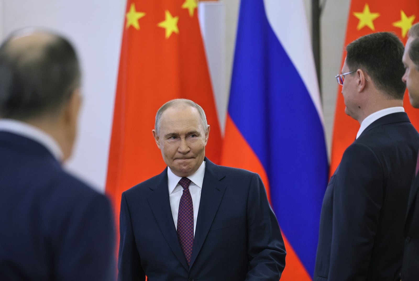 Russian President Vladimir Putin arrives for his talks with China President Xi Jinping at the Kremlin in Moscow, Russia, Thursday, May 8, 2025, ahead of celebrations of the 80th anniversary of the Soviet Union's victory over Nazi Germany during the World War II. (Yuri Kochetkov/Pool Photo via AP)