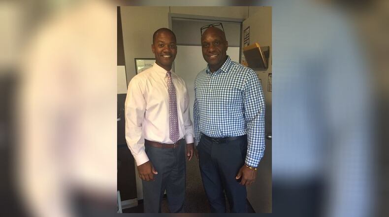Former Middletown Schools’ Rosa Parks Elementary Principal Bryan Cannon (right) - pictured with Middletown Schools Superintendent Marlon Styles Jr. - has left the district under resignation agreement but district officials are not saying why. Under the agreement obtained by the Journal-News, Cannon continues to be paid almost half of his annual $95,500 salary though he is no longer employed by the school system.