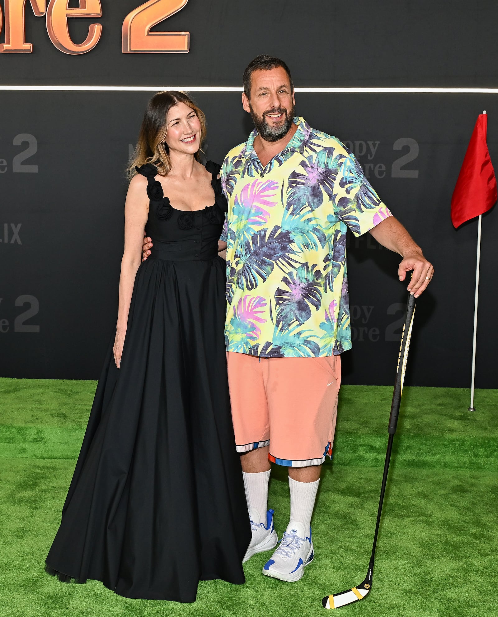Jackie Sandler, left, and Adam Sandler attend the premiere of Netflix's "Happy Gilmore 2" at Jazz at Lincoln Center on Monday, July 21, 2025, in New York. (Photo by Evan Agostini/Invision/AP)