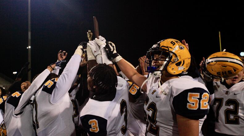 Springfield celebrates a victory against Marysville in a Division I regional final on Friday, Nov. 19, 2021, at Hilliard Darby High School. David Jablonski/Staff