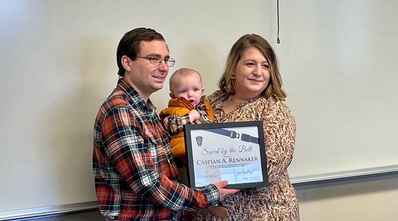 Micheala and Donovan Rennaker, and their son Caspian, survived what could have been a deadly car crash in February thanks to the use of safety belts and a properly secured infant car seat. The family was honored Saturday with the Ohio Department of Public Safety's "Saved by the Belt" award.