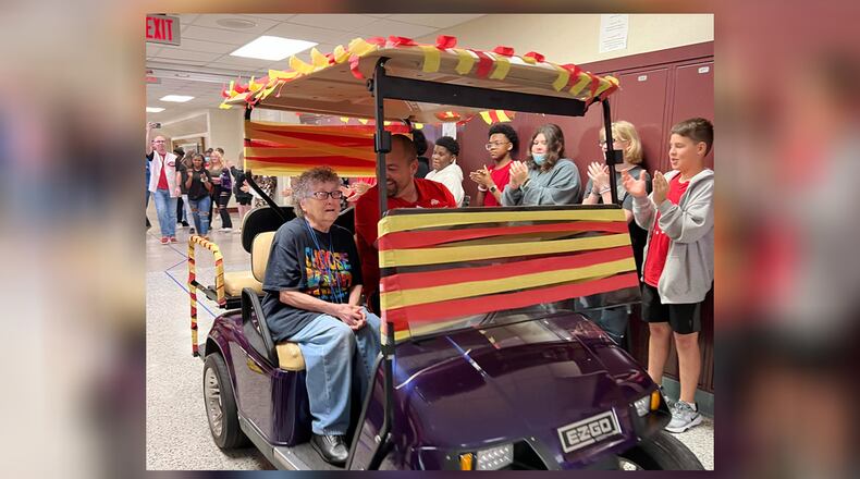 Fay Stewart, at a then-82 years old, retired from the Hamilton City Schools, and though she worked at several school buildings, she last worked at Garfield Middle School, where she worked with special needs students. Pictured is Stewart with Garfield Middle School Principal Matt Schermer at her retirement celebration at the end of the 2022 school year. PROVIDED/GARFIELD MIDDLE SCHOOL