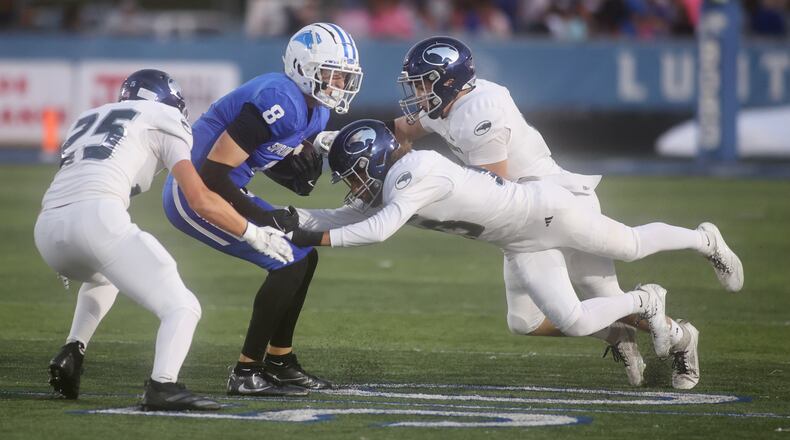 Springboro's Brady Guttman is tackled by Fairmont on Friday, Oct. 10, 2025, at CareFlight Field in Springboro. David Jablonski/Staff
