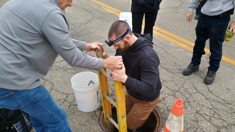 Officials from the Butler County Emergency Management Agency, the Butler County Coroner’s Office and Hamilton Police Department search the underground sewer system on Market Street Friday, March 20, 2026. Authorities were looking for any additional remains or evidence connected to the death of William Lee Campbell, who went missing in 2022, but whose remains were discovered in the sewer last August. PHOTO COURTESY OF HAMILTON POLICE DEPARTMENT