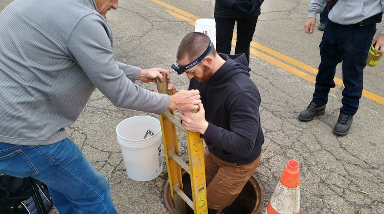 Officials from the Butler County Emergency Management Agency, the Butler County Coroner’s Office and Hamilton Police Department search the underground sewer system on Market Street Friday, March 20, 2026. Authorities were looking for any additional remains or evidence connected to the death of William Lee Campbell, who went missing in 2022, but whose remains were discovered in the sewer last August. PHOTO COURTESY OF HAMILTON POLICE DEPARTMENT