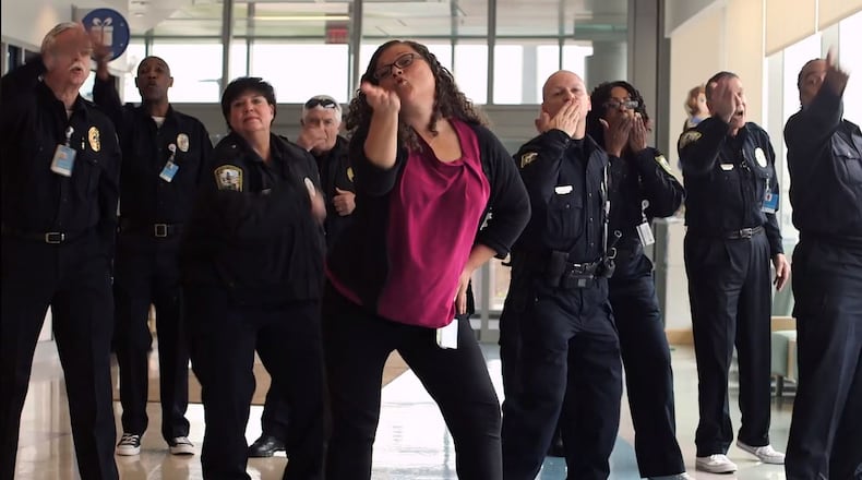 Stacey Adidou, a Cincinnati Children’s senior administrative assistant, leads a dance she choreographed during Cincinnati Children’s Hospital Medical Center’s “Can’t Stop the Healing” Holiday Video.