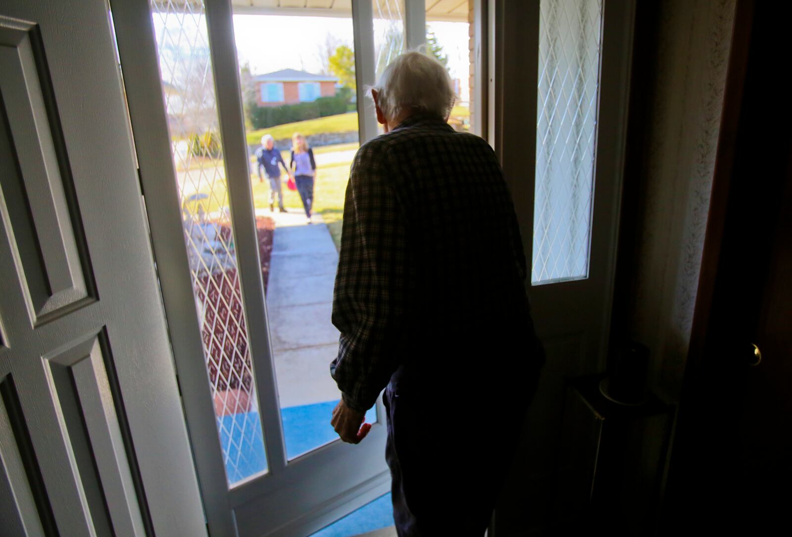 Meals are just one of the services the Butler County Elderly Services Program offers. Other services include items like transportation and emergency monitoring. Gorman Bruce greets Community First Solutions Meals on Wheels driver Don Peters and Emily Glaser during a delivery on March 18 to his Fairfield home.