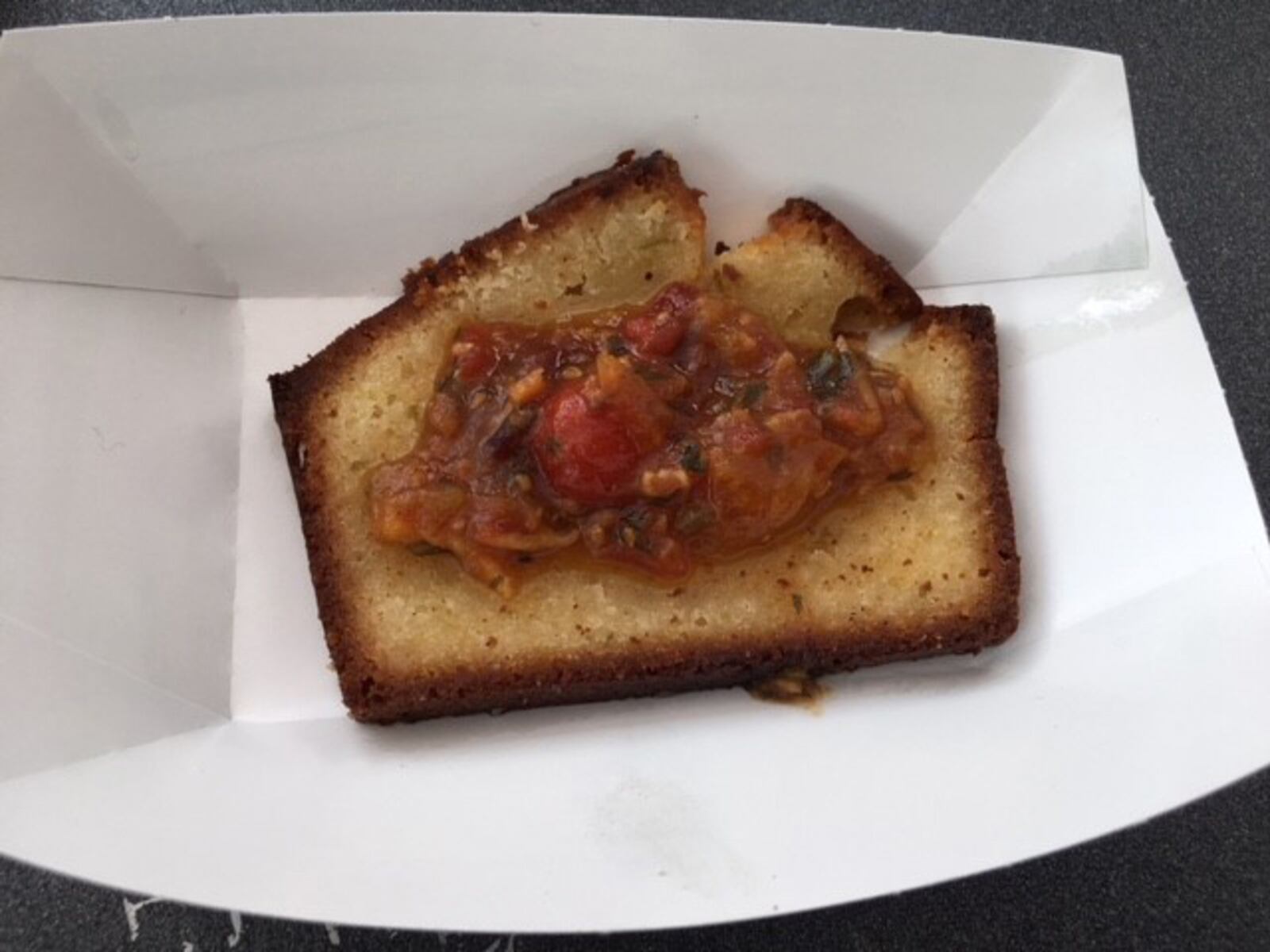 Bacon pound cake from Dewberry 1850. This citrus bacon poundcake is topped with bacon and tomato jam at the BaconFest festival. ALEXIS LARSEN / CONTRIBUTED