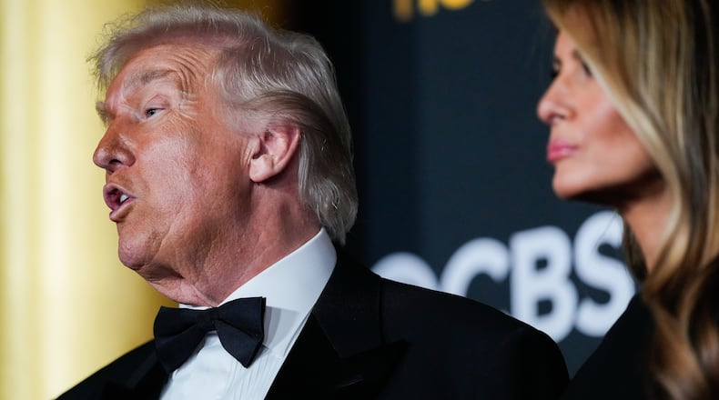President Donald Trump and first lady Melania Trump walk the red carpet before the 48th Kennedy Center Honors, Sunday, Dec. 7, 2025, at the John F. Kennedy Center for the Performing Arts in Washington. (AP Photo/Julia Demaree Nikhinson)