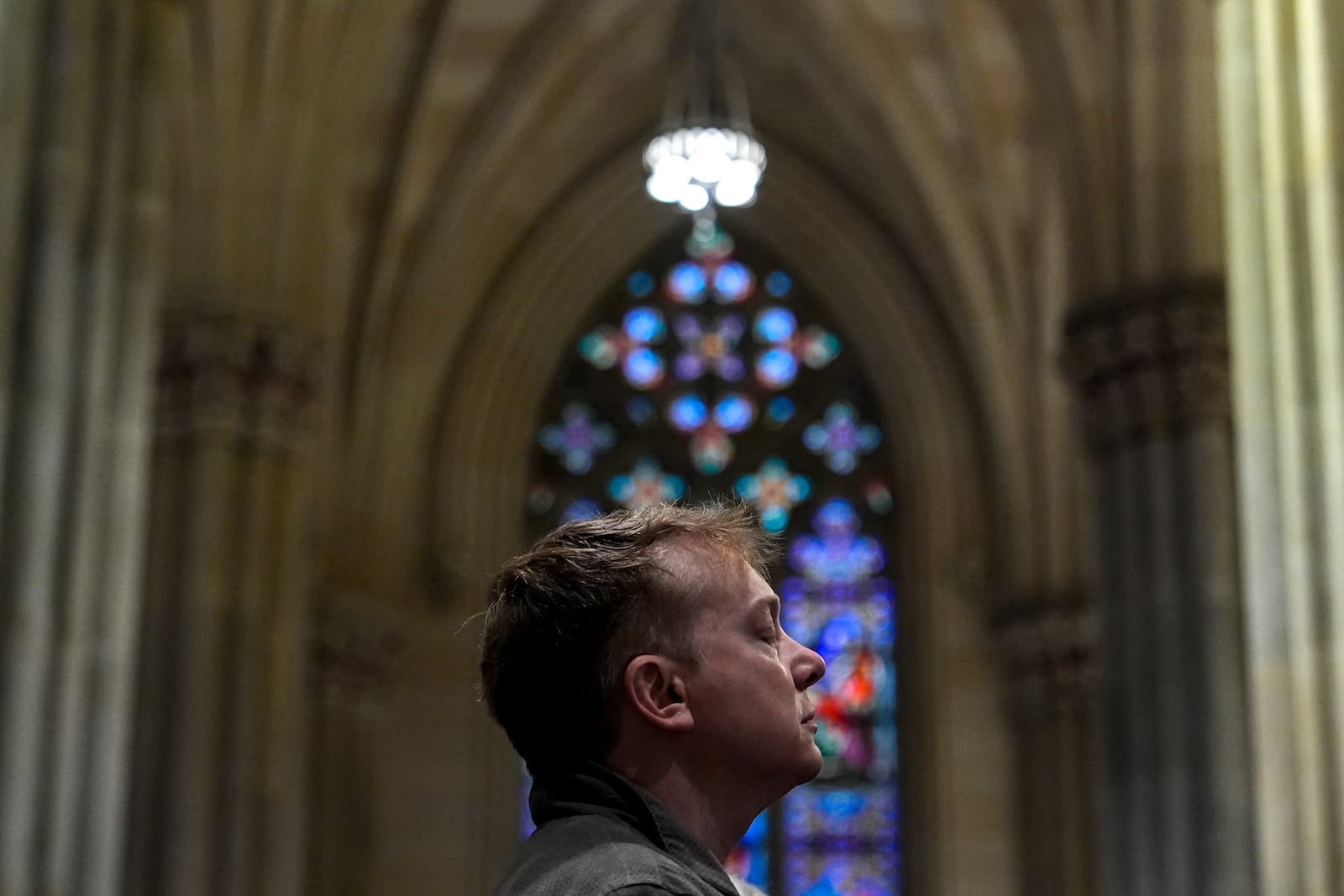 A parishioner prays during a memorial mass for the late Pope Francis at St. Patrick's Cathedral, Saturday, April 26, 2025, in New York. (AP Photo/Julia Demaree Nikhinson)