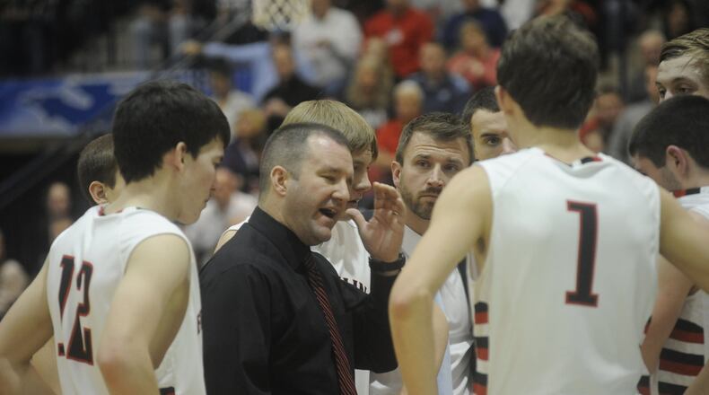 Franklin coach Brian Bales rallies the Wildcats. Franklin defeated Alter 66-58 in the boys high school basketball Division II sectional at Kettering’s Trent Arena Feb. 24, 2014. MARC PENDLETON / STAFF