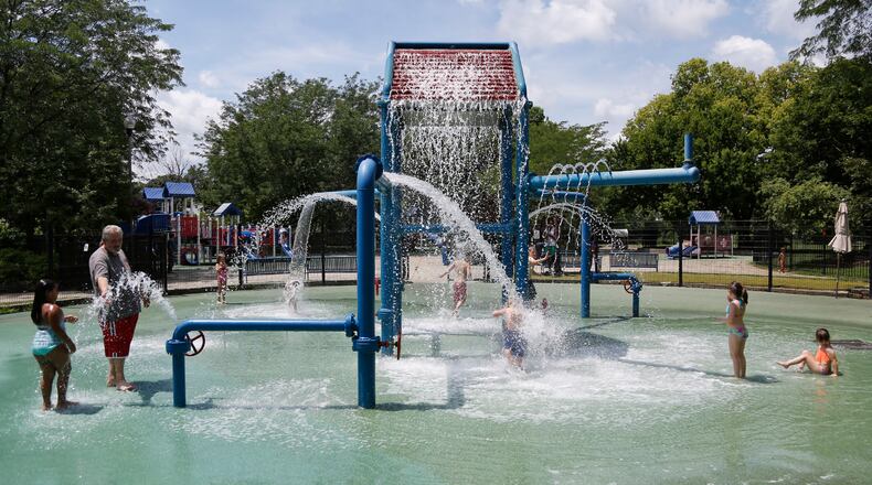 The splash pad at Island Park was a popular location on Thursday as the temperatures rose above 90 with high humidity. Residents from Dayton, Kettering and New Carlisle were there at noon. A high heat index is expected to last through Satruday, making work outdoors potentially dangerous for those not acclimated to it.  TY GREENLEES / STAFF