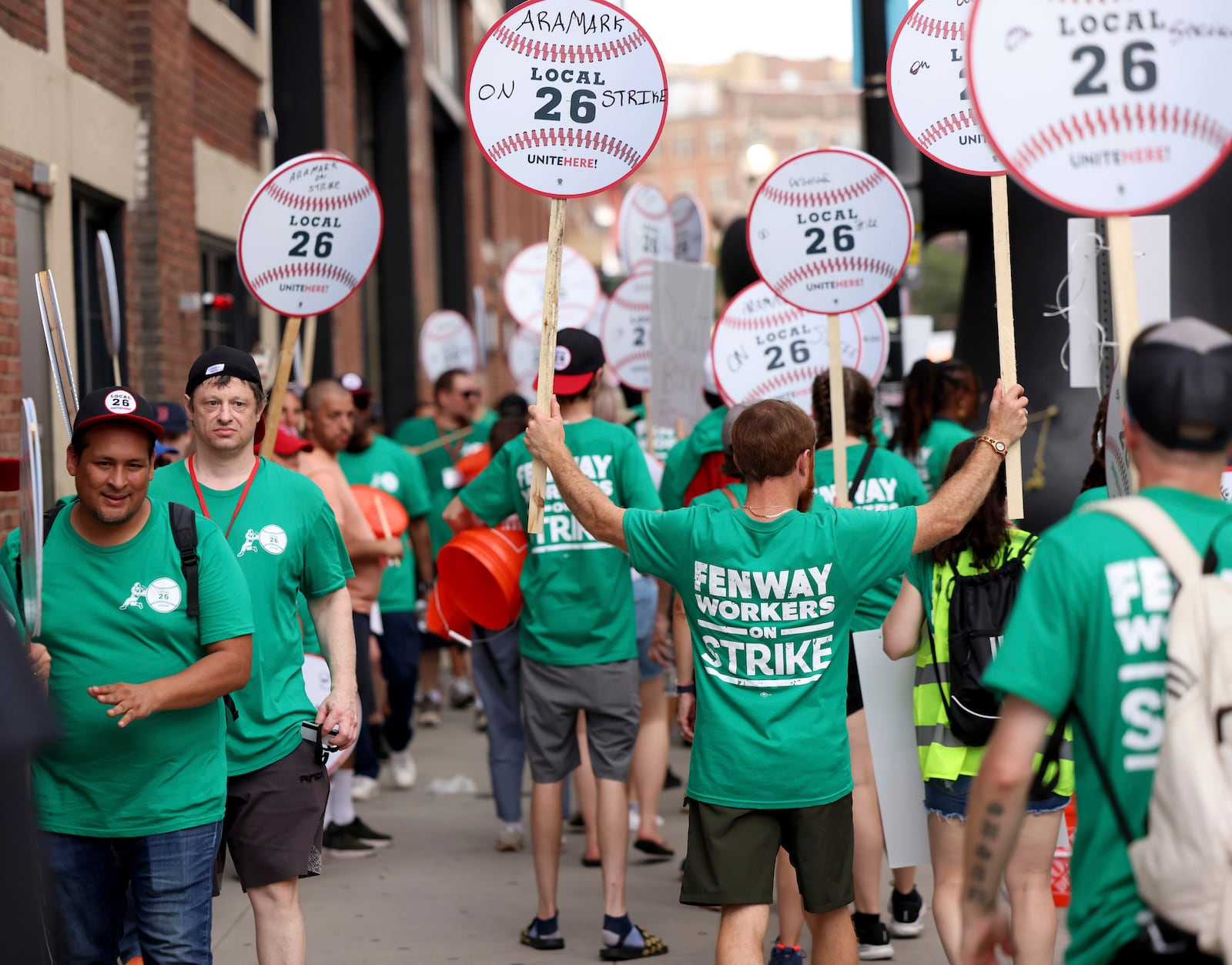 Concession workers from Fenway Park picket outside the ballpark Friday, July 25, 2025, in Boston before a baseball game between the Boston Red Sox and the Los Angeles Dodgers. (AP Photo/Mark Stockwell)