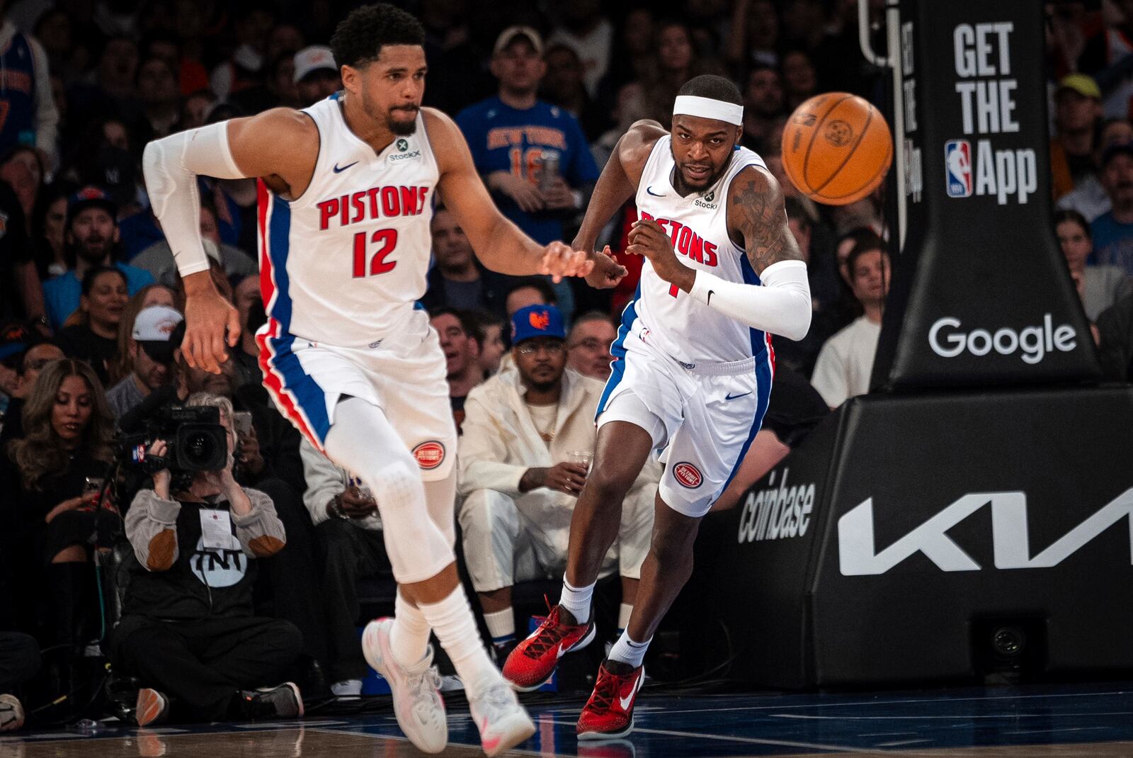 Detroit Pistons forwards Paul Reed, right, and Tobias Harris (12) race for a rebound ball during the first quarter of Game 2 of an NBA basketball first-round playoff series against the New York Knicks, Monday, April 21, 2025, in New York. (AP Photo/Angelina Katsanis)