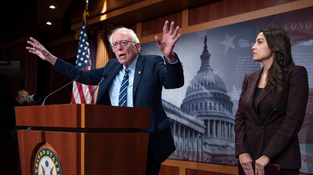 Sen. Bernie Sanders, I-Vt., left, and Rep. Alexandria Ocasio Cortez, D-N.Y., hold a news conference on the Artificial Intelligence Data Center Moratorium Act, at the Capitol in Washington, Wednesday, March 25, 2026. (AP Photo/J. Scott Applewhite)