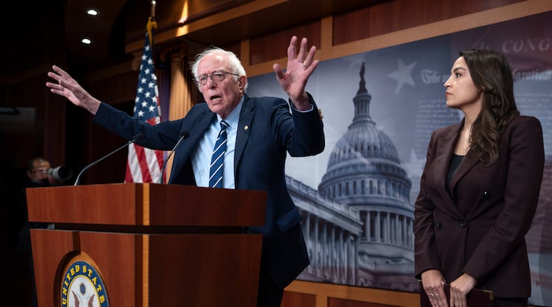 Sen. Bernie Sanders, I-Vt., left, and Rep. Alexandria Ocasio Cortez, D-N.Y., hold a news conference on the Artificial Intelligence Data Center Moratorium Act, at the Capitol in Washington, Wednesday, March 25, 2026. (AP Photo/J. Scott Applewhite)