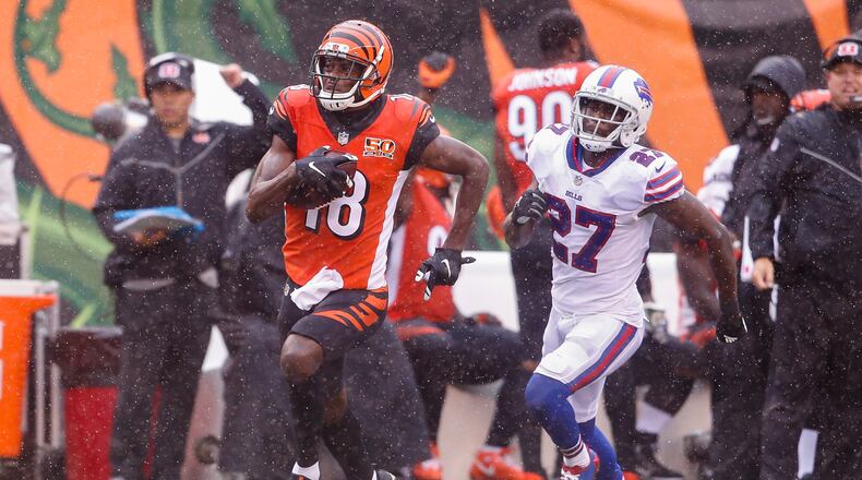Cincinnati Bengals wide receiver A.J. Green (18) runs past Buffalo Bills cornerback Tre’Davious White (27) for a touchdown in the first half of an NFL football game, Sunday, Oct. 8, 2017, in Cincinnati. (AP Photo/Gary Landers)
