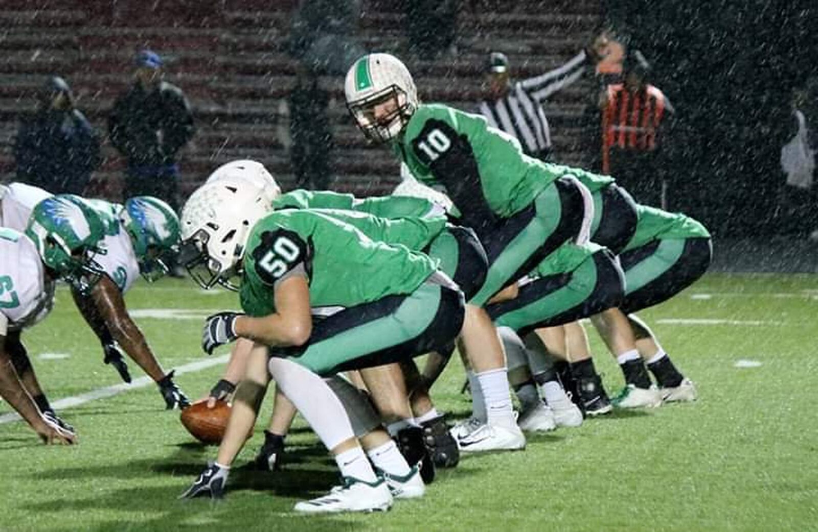 Badin quarterback Zach Switzer (10) prepares to take a snap during a 38-21 win over Chaminade Julienne on Friday night at Fairfield Stadium in Fairfield. CONTRIBUTED PHOTO BY TERRI ADAMS