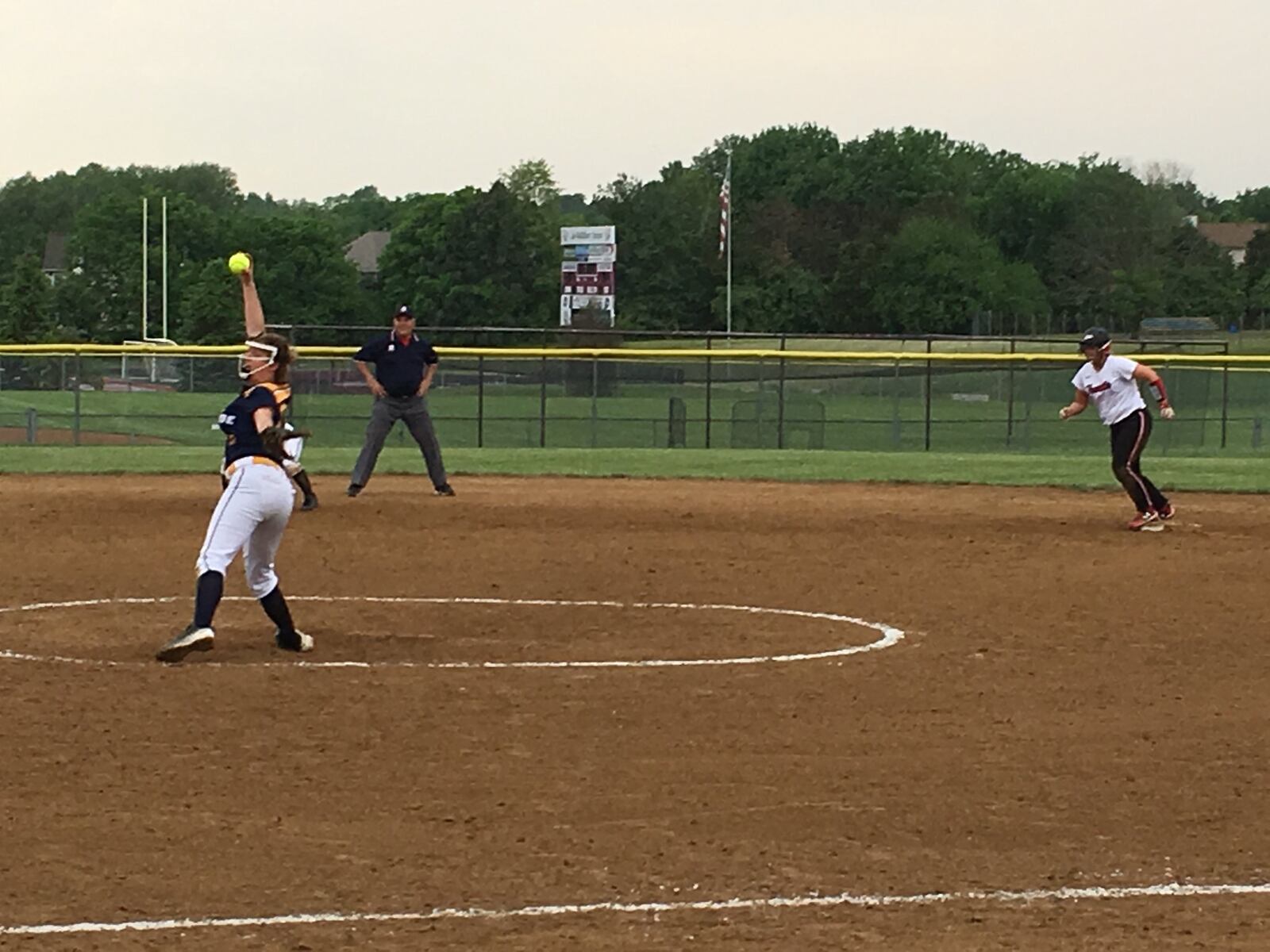Monroe pitcher Alyssa Wagner winds up as Franklin’s Olivia Kelly watches from second base during Wednesday’s Division II district semifinal at Lebanon. RICK CASSANO/STAFF