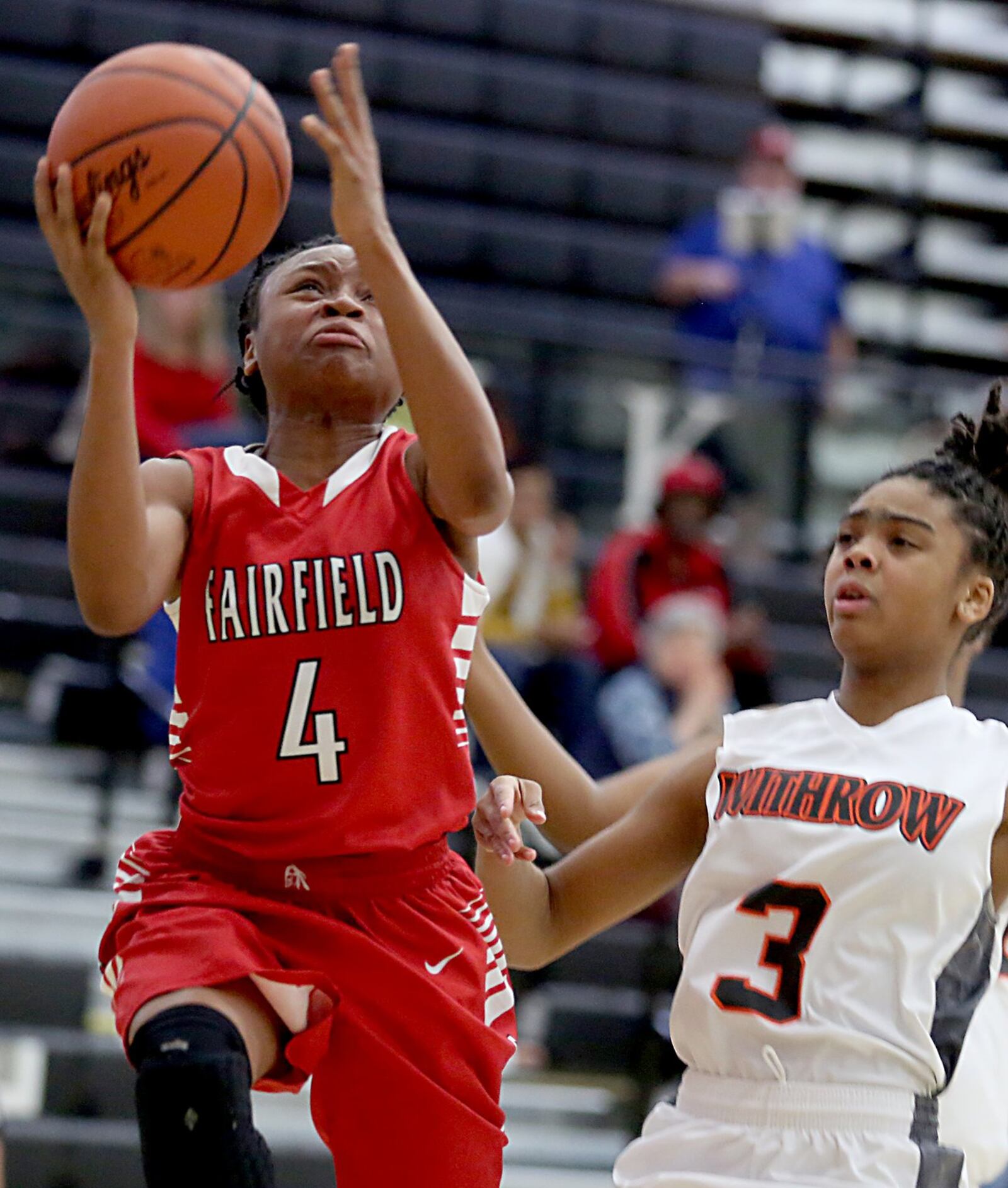 Fairfield guard Zahrya Bailey gets the basket and the foul from Withrow forward Ashley Brunner during their Division I sectional game at Lakota East on Saturday afternoon. CONTRIBUTED PHOTO BY E.L. HUBBARD