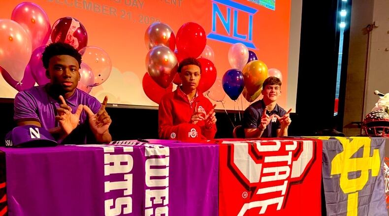 From left, Lakota West seniors Joshua Fussell (Northwestern), Malik Hartford (Ohio State) and Ben Minich (Notre Dame) signed letters of intent on National Signing Day on Dec. 21, 2022. Chris Vogt/CONTRIBUTED